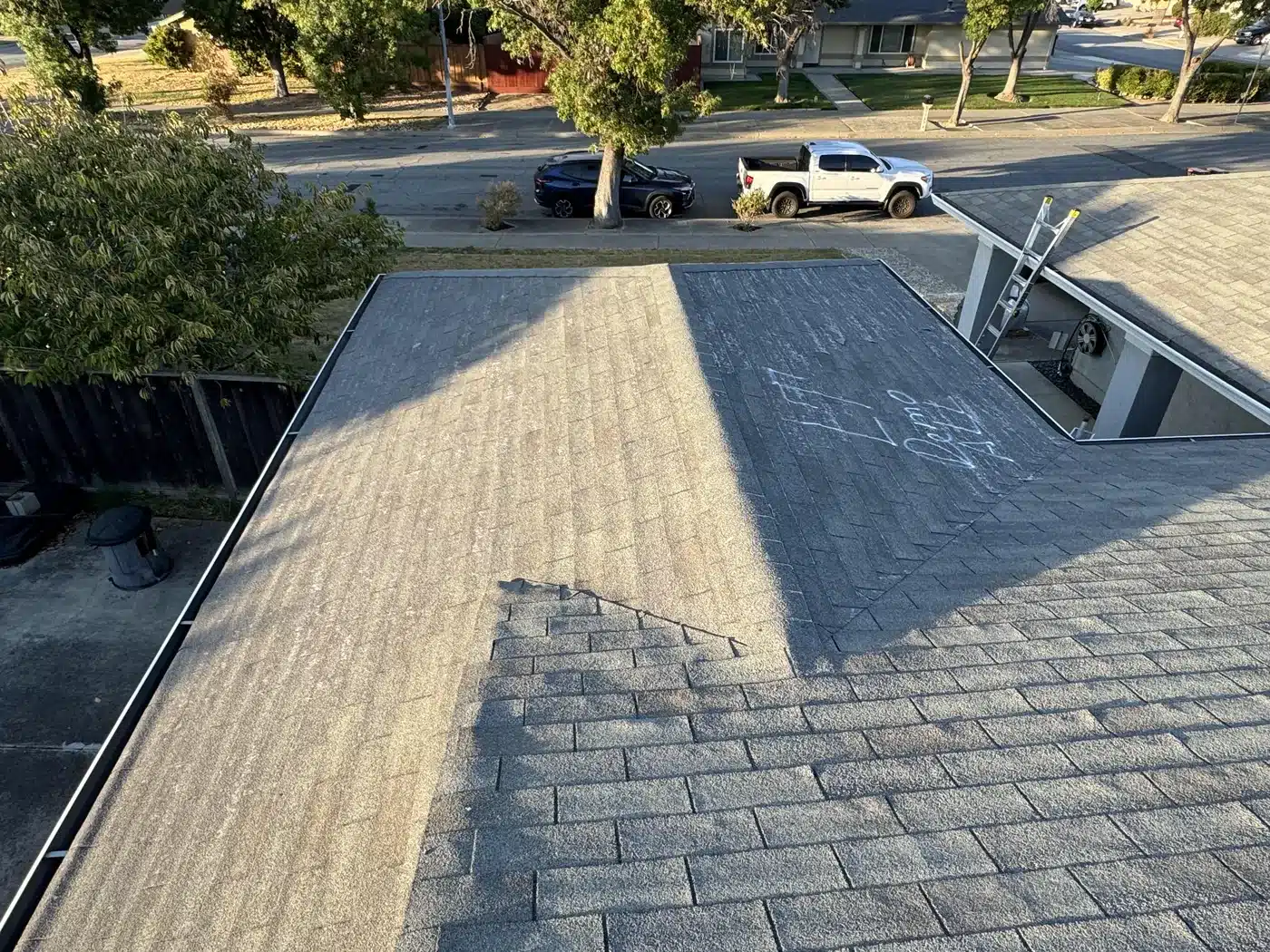 Worn shingle roof marked for replacement on Sylvester Drive in Fremont