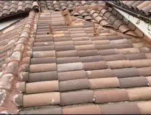 Clay barrel tiles relaid in straight courses with re-flashed pipe vents after the Benicia leak repair