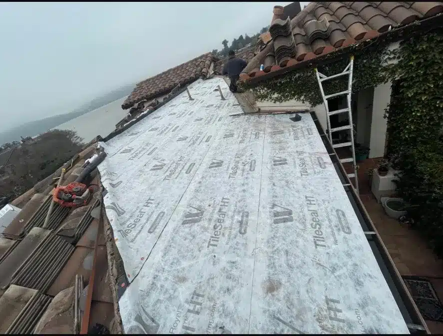 New TileSeal HT underlayment covering the repair section before the clay tiles go back in Benicia