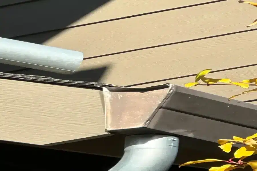 Damaged rain gutter corner in San Jose requiring repair
