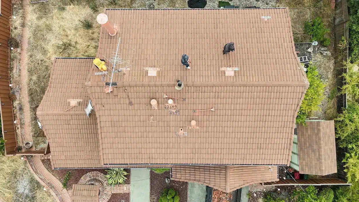 Overhead view of the concrete tile roof with a rooftop TV antenna and terracotta-painted vents, Proctor Road, Castro Valley CA