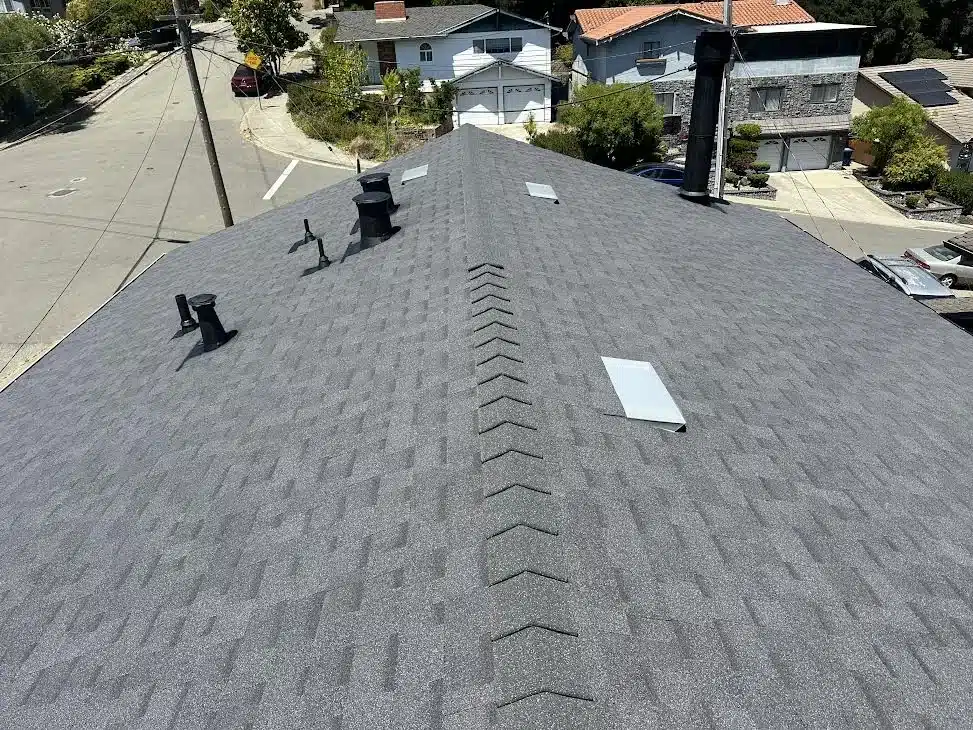 Close view of the new architectural shingles, ridge cap and black roof vents, Proctor Road, Castro Valley CA