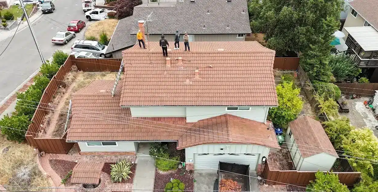 Brown concrete tile roof on a two-storey home in Castro Valley before replacement