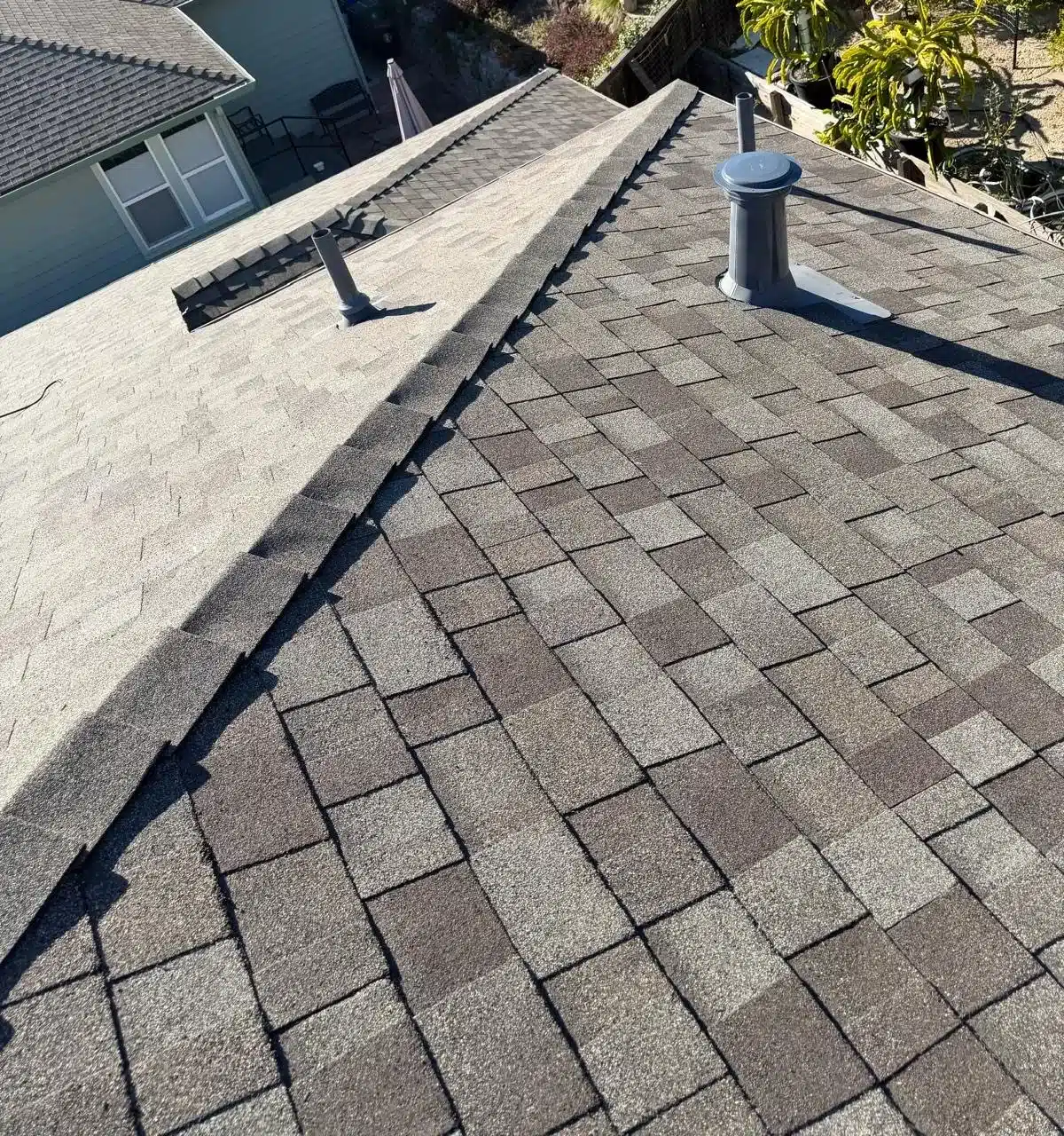 New shingles with ridge cap and sealed pipe flashing on the El Sobrante reroof