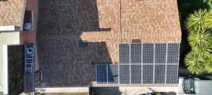 Aerial view of the replaced shingle roof section with solar panels reinstalled on a Berkeley home