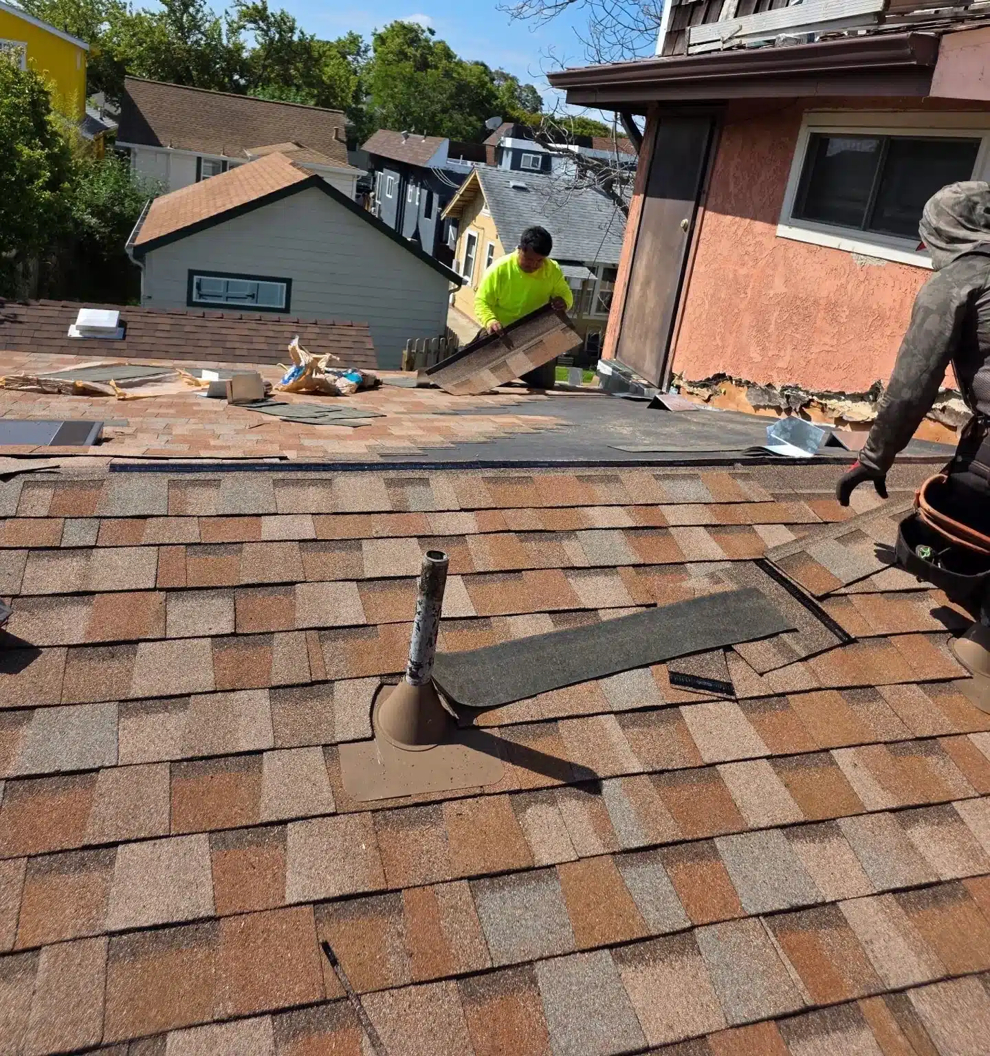 New shingles and a sealed pipe flashing going on over the Berkeley roof section