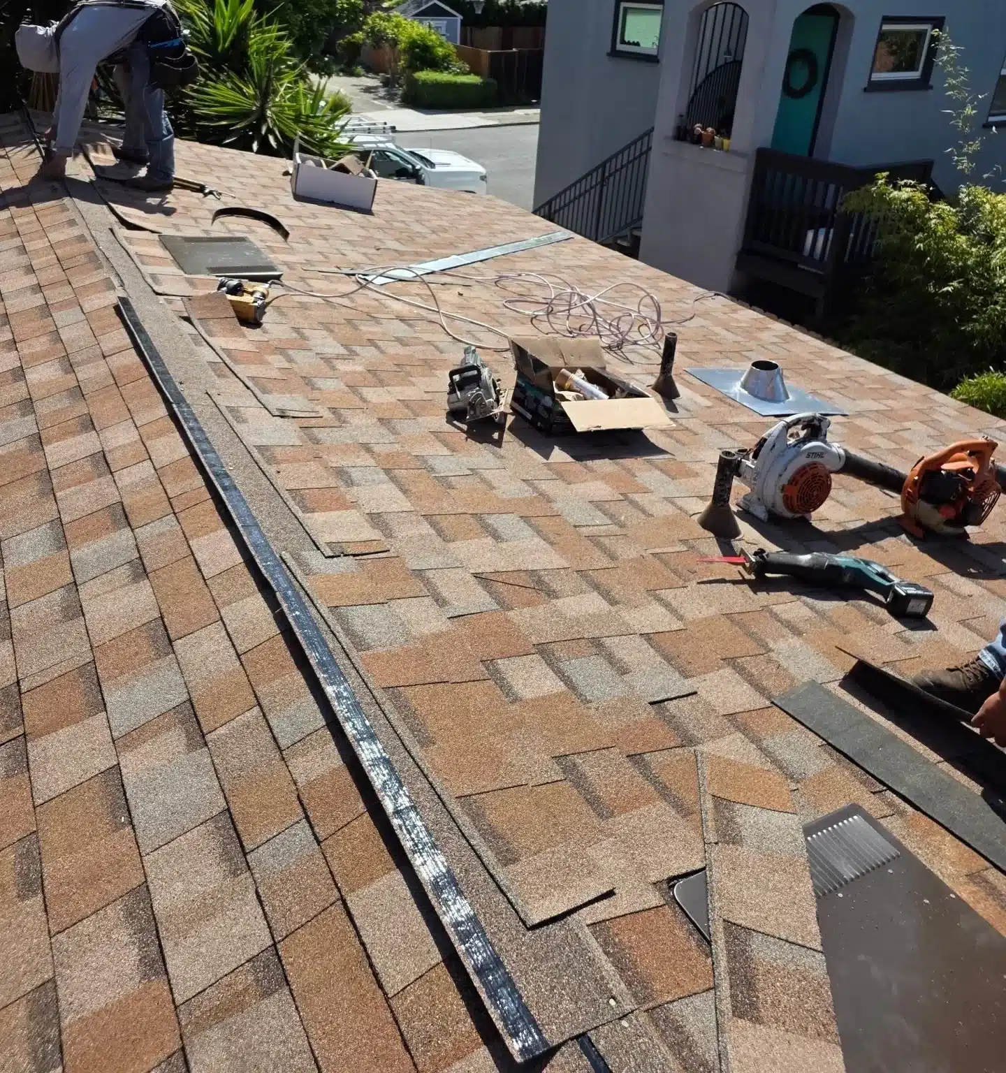 Hip cap shingles going on to close out the new roof section in Berkeley