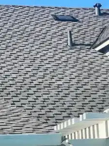 New gray CertainTeed Presidential shingle roof with a skylight and new vents on a house in Campbell CA