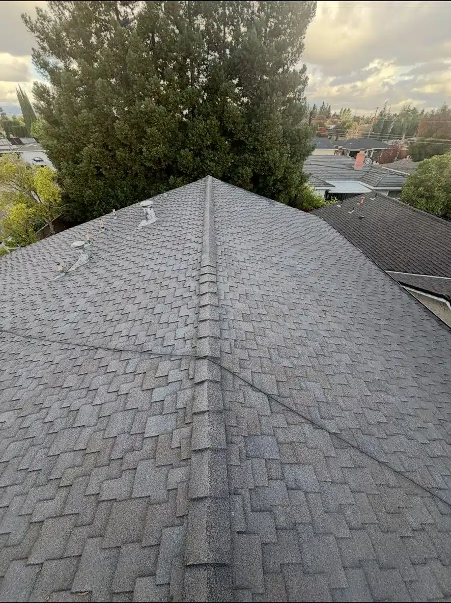 Worn gray asphalt shingle ridge before the reroof in San Jose