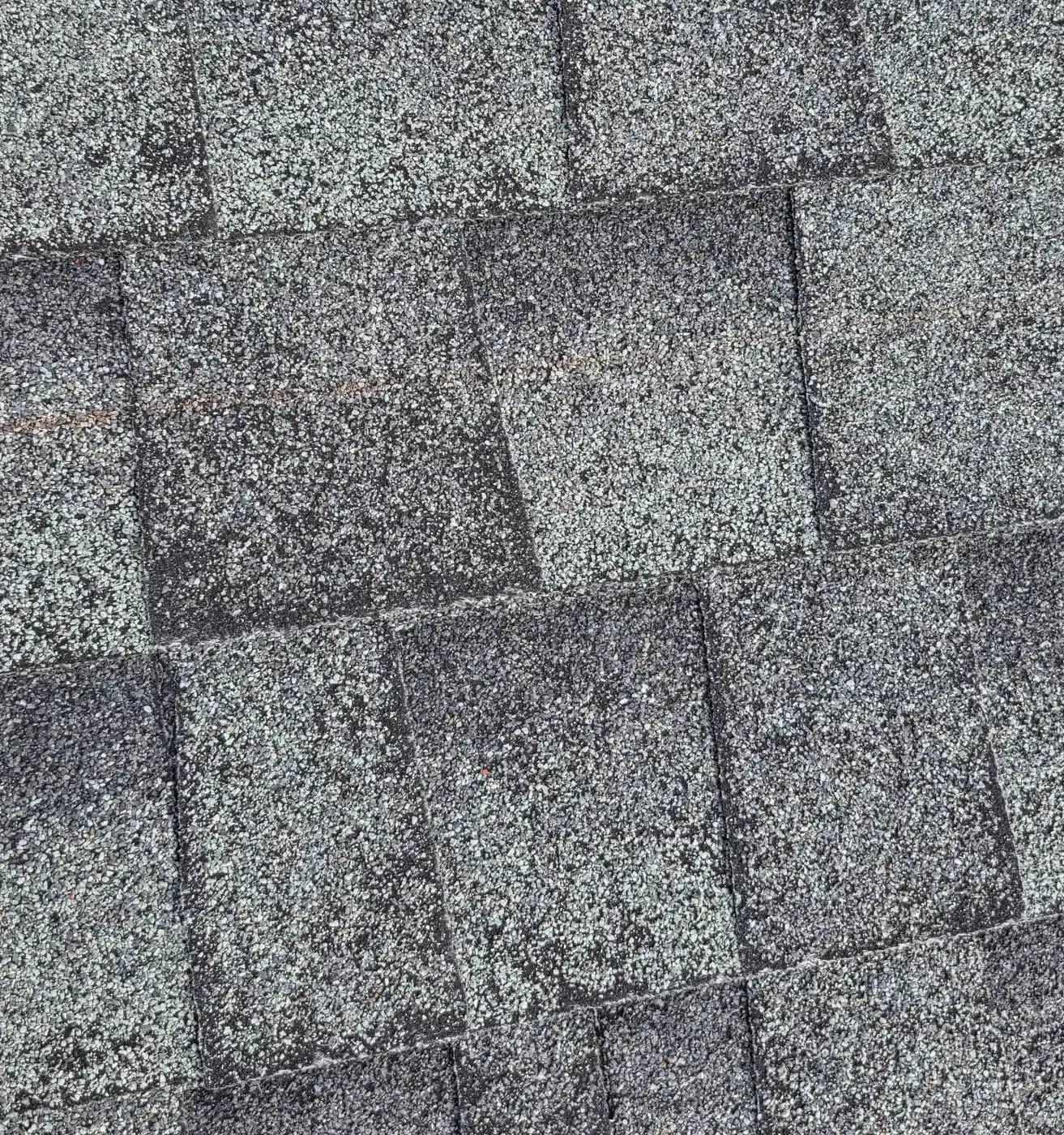 Mismatched replacement shingles patched into a weathered asphalt shingle roof before replacement in San Rafael