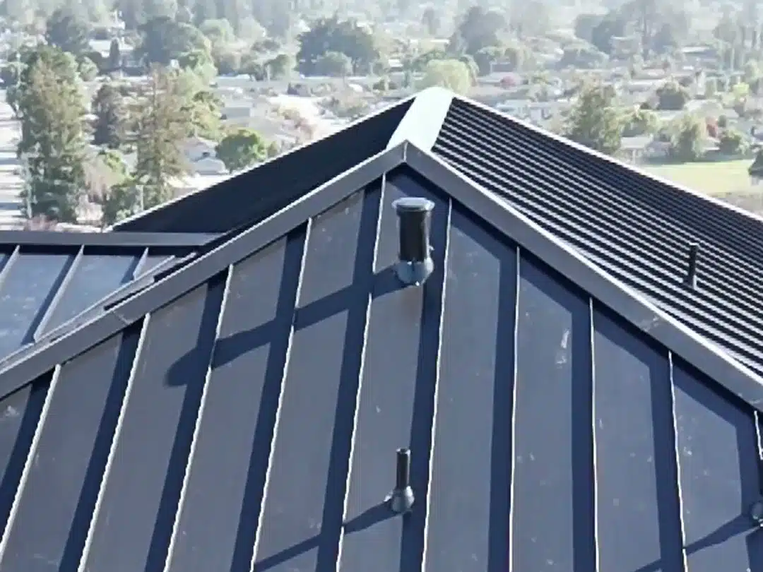 Gable of a standing-seam metal roof with concealed fasteners on a Bay Area home