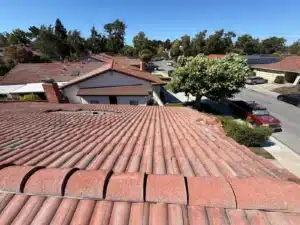 Concrete tile roof relaid over new underlayment on a single-story San Mateo home, with ridge tiles reset