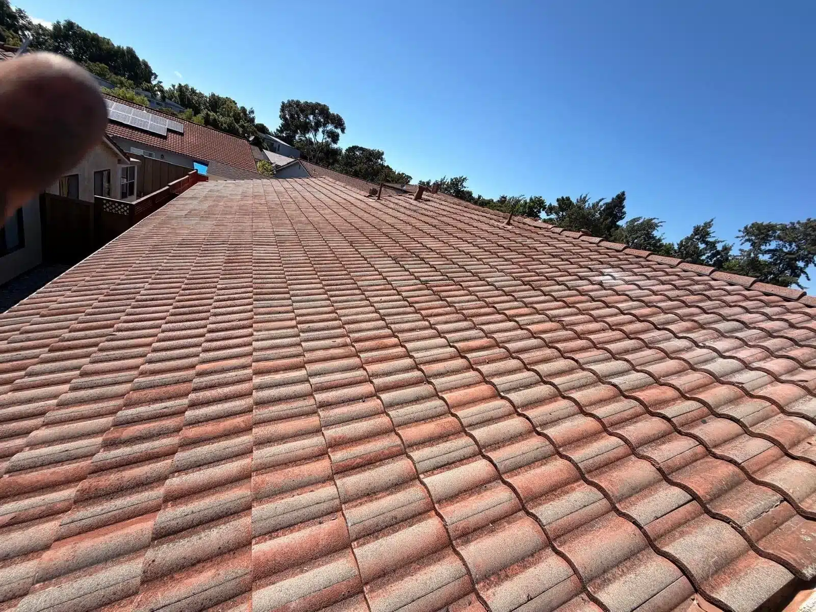 Finished field of reset concrete tile on a San Mateo roof after the tile reset